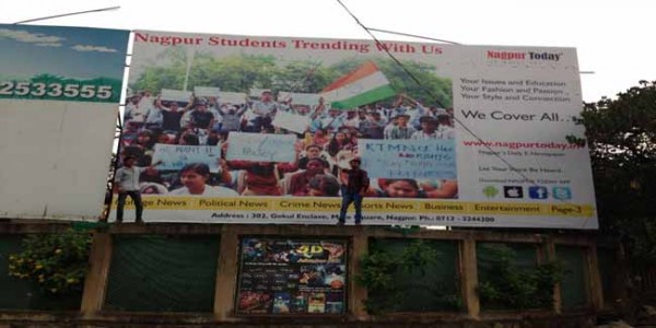Together we stand united… Both the students pose atop the billboard of Nagpur Today to celebrate their freedom of expression. 