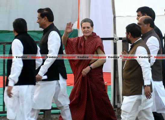 Marching towards dais  Congress President Sonia Gandhi greets the crowd as she walked towards the venue along with the senior Congress leaders. 