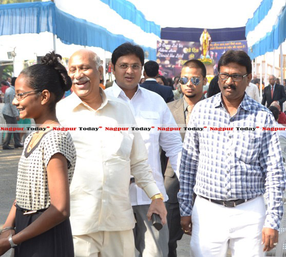 MP Vilas Muttemwar, his son Vishal Muttemwar and some guests after attending the early morning mass at SFS Cathedral