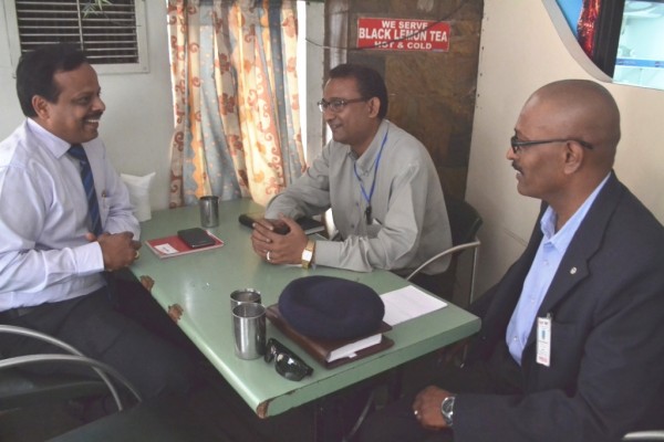 A Palanisamy ( left ) interacting with Manohar Roy and Samuel 